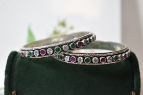 Round green white and rubycutstone silver bangles